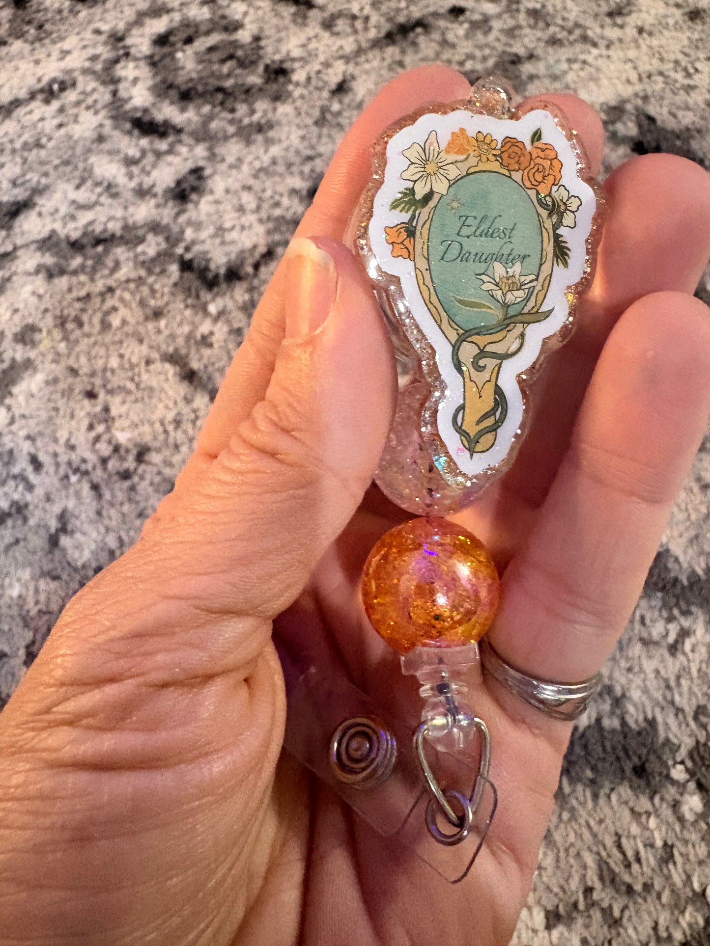 Eldest daughter badge reel